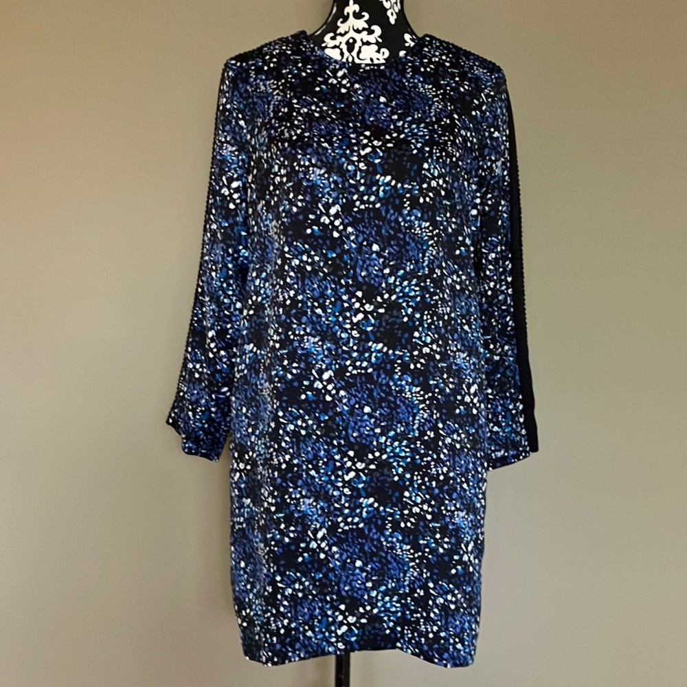 Banana shift dress with black tiny pompon trim down shoulders.